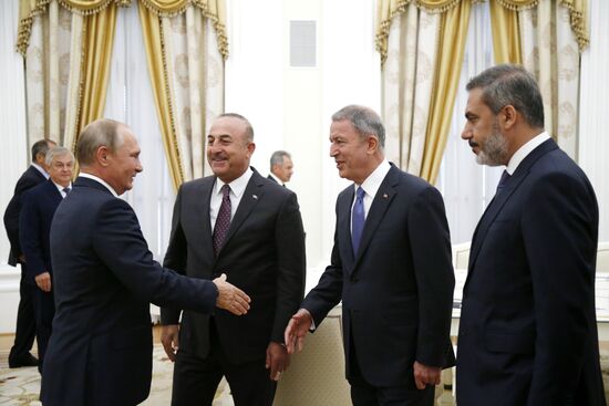 Russian President Vladimir Putin meets with Turkish Foreign Minister Mevlut Cavusoglu