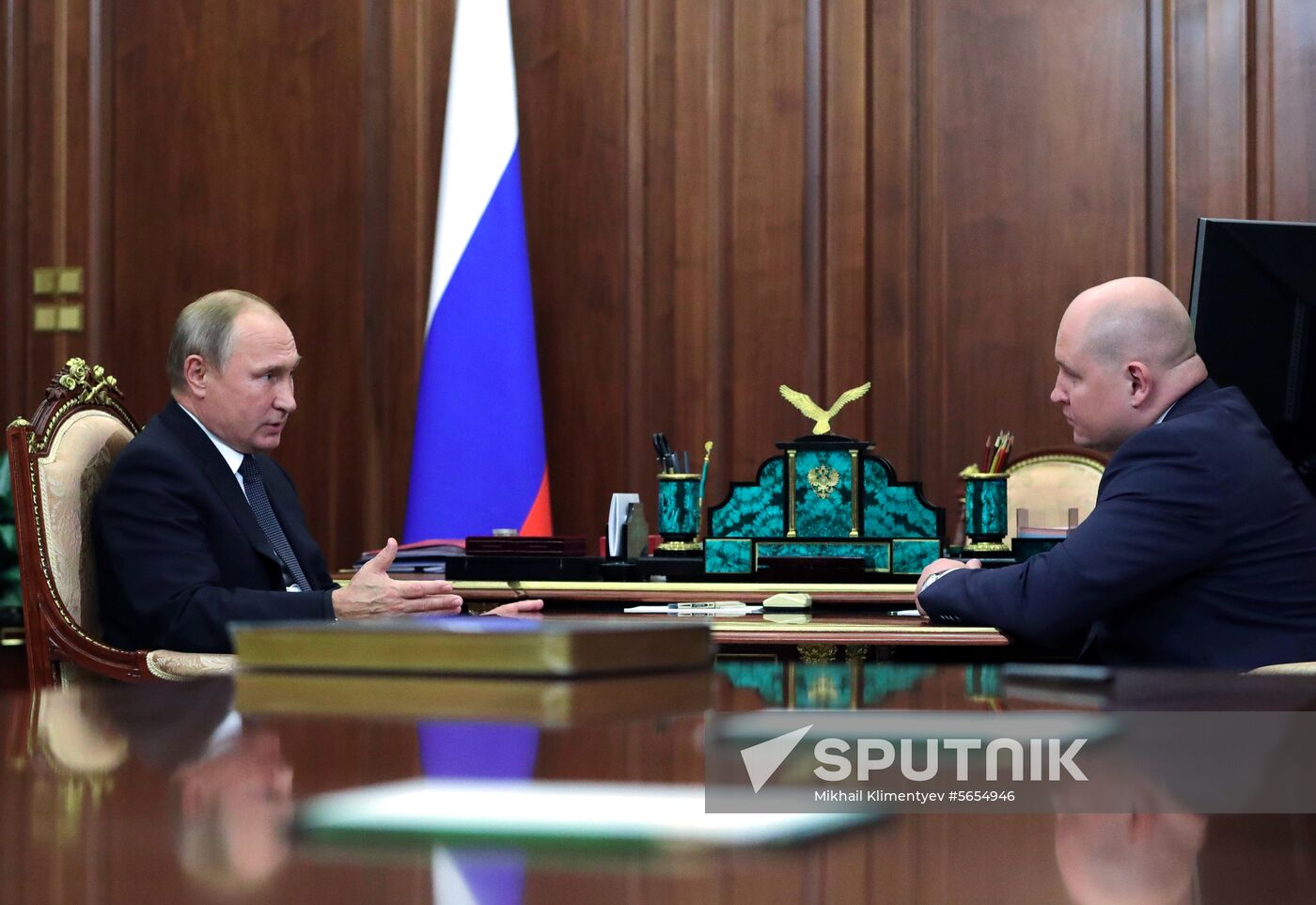 President Vladimir Putin meets with Mikhail Razvozhayev