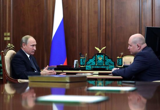 President Vladimir Putin meets with Mikhail Razvozhayev