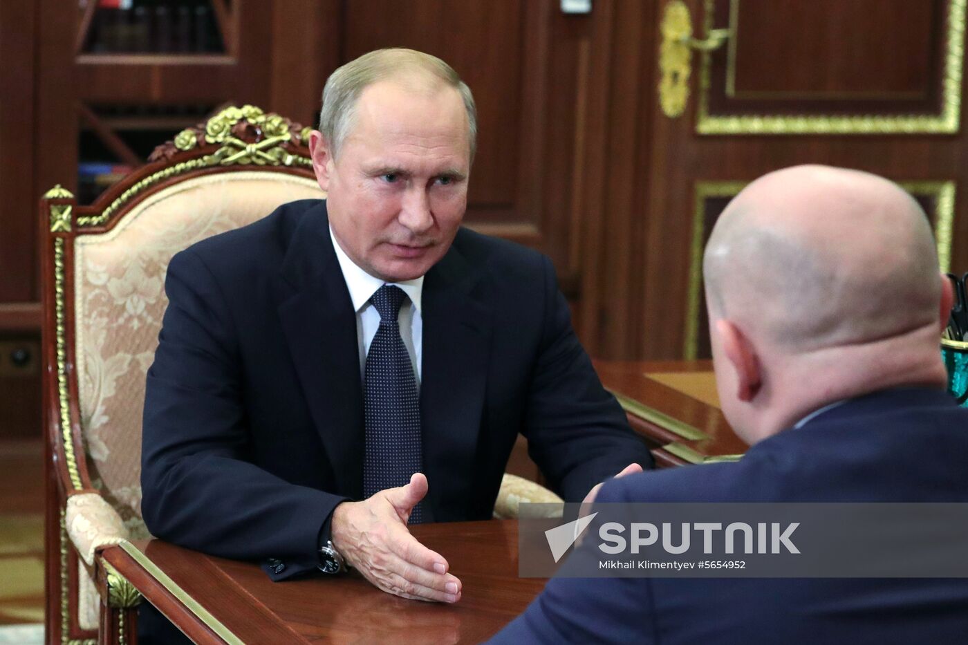 President Vladimir Putin meets with Mikhail Razvozhayev