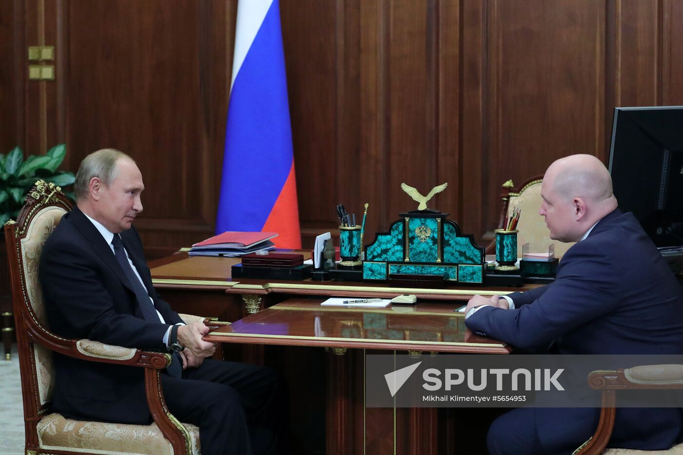 President Vladimir Putin meets with Mikhail Razvozhayev