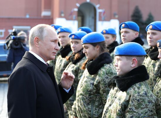 President Vladimir Putin lays flowers at Monument to Minin and Pozharsky
