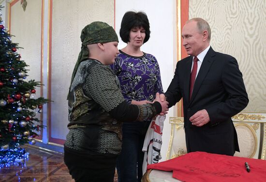 President Vladimir Putin meets with Nikolai Kuznetsov, participant in the Dream with Me project