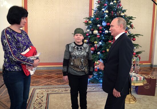 President Vladimir Putin meets with Nikolai Kuznetsov, participant in the Dream with Me project
