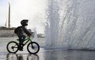 A boy rides a bike in the town of Sevastopol, Crimea, Russia. Location: Russia. Author: Alexey Malgavko/Sputnik. Russia Crimea Daily Life