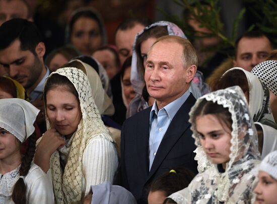 Russian President Putin attends Christmas service