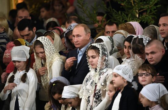 Russian President Putin attends Christmas service