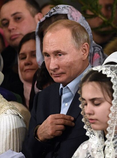 Russian President Putin attends Christmas service