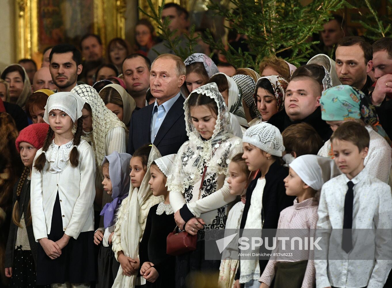 Russian President Putin attends Christmas service