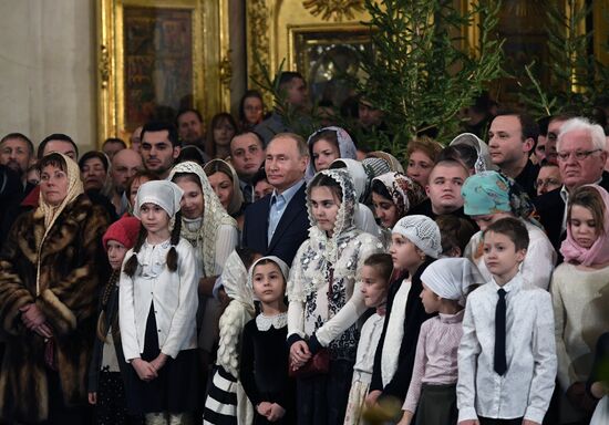 Russian President Putin attends Christmas service
