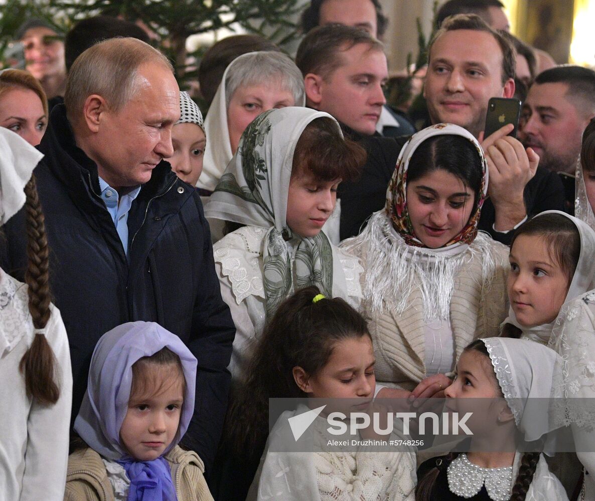 Russian President Putin attends Christmas service