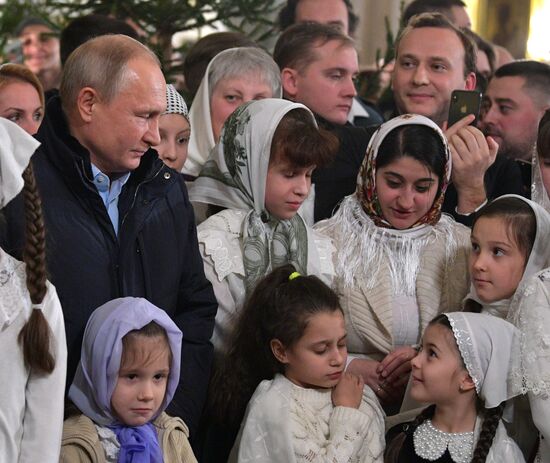 Russian President Putin attends Christmas service