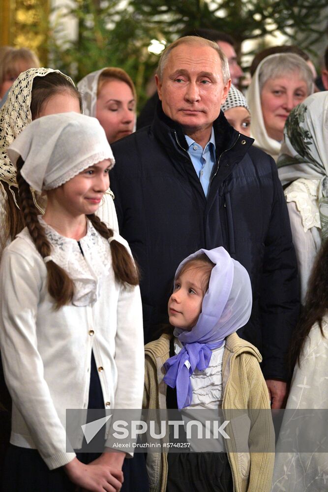 Russian President Putin attends Christmas service