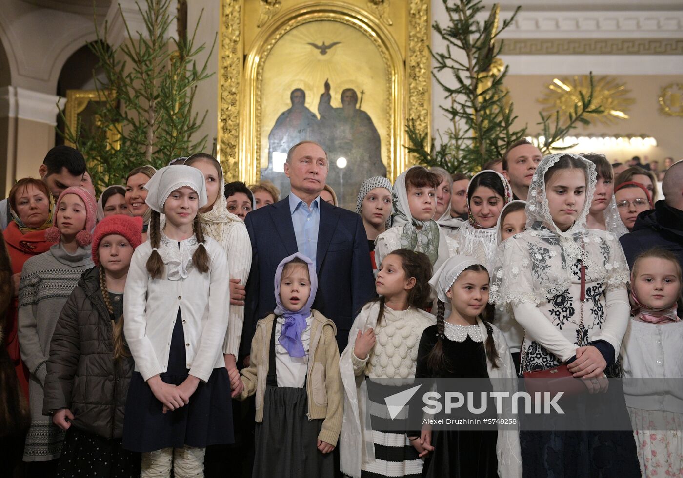 Russian President Putin attends Christmas service