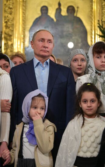 Russian President Putin attends Christmas service