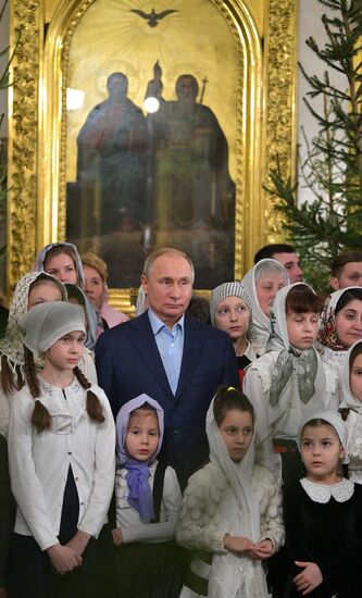 Russian President Putin attends Christmas service