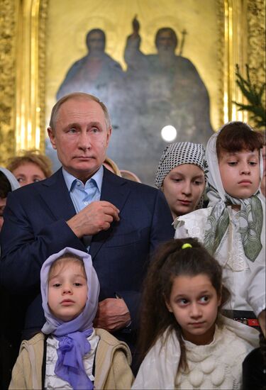 Russian President Putin attends Christmas service