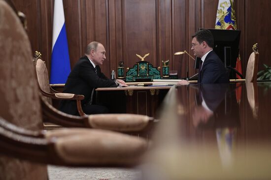 President Vladimir Putin meets with Energy Minister Alexander Novak
