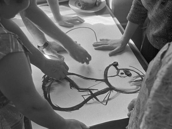 Artists draw sketch of wooden toy