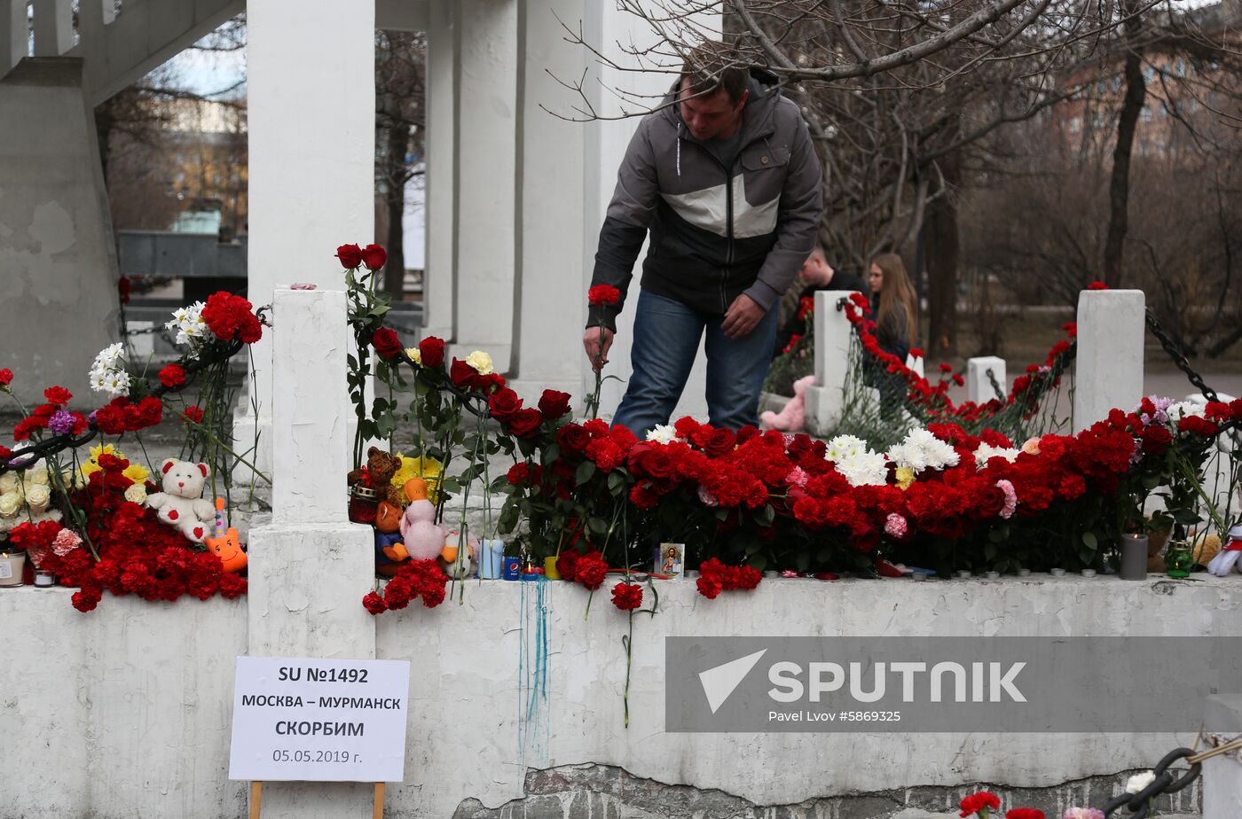 A man lays flowers at the makeshift memorial in downtown Murmansk, Russia. The fire aboard the Aeroflot's Sukhoi Superjet 100 passenger plane broke out after the plane made a hard emergency landing at Moscow's Sheremetyevo airport. The plane had taken off from the airport bound for Murmansk but turned back after encountering unspecified problems in the air. Location: Russia, Murmansk. Author: Pavel Lvov/Sputnik. Russia Plane Fire