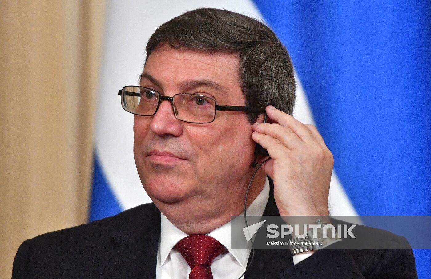 Cuban Foreign Minister Bruno Rodriguez adjusts his headphones as he attends a joint news conference with his Russian counterpart Sergei Lavrov following their meeting in Moscow, Russia. Location: Russia, Moscow. Author: Maksim Blinov/Sputnik. Russia Cuba