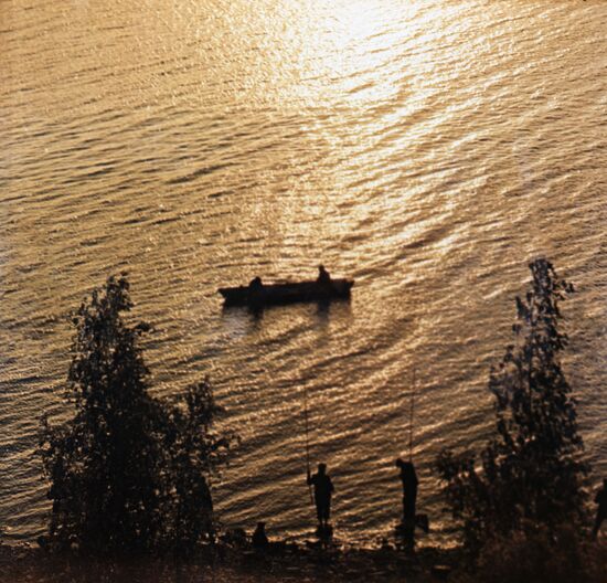Fishers on Lake Balkhash at sunset