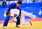 Czech Republic's Pavel Petrikov and Georgia's Bagrati Niniashvili compete during the men's 66 kg half-light weight bronze medal judo contest at the 2nd European Games in Minsk, Belarus. Location: Belarus, Minsk. Author: Vladimir Astapkovich/Sputnik. Belarus European Games Judo