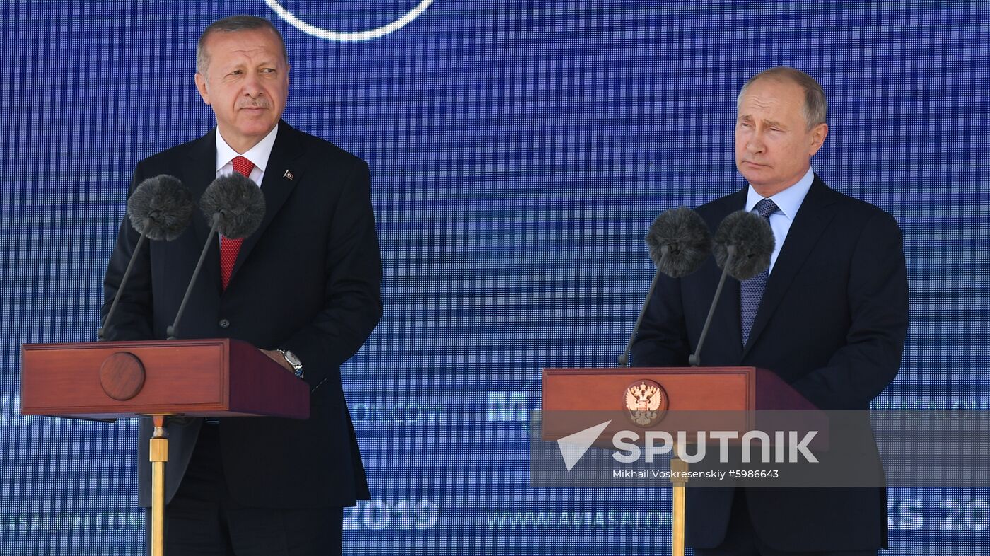 Russian President Vladimir Putin and his Turkish counterpart Recep Tayyip Erdogan, left, attend an opening ceremony at the MAKS-2019 international aviation and space show in Zhukovsky, outside Moscow, Russia. Location: Russia, Zhukovsky. Author: Mikhail Voskresenskiy/Sputnik. Russia MAKS Air Show Putin Erdogan