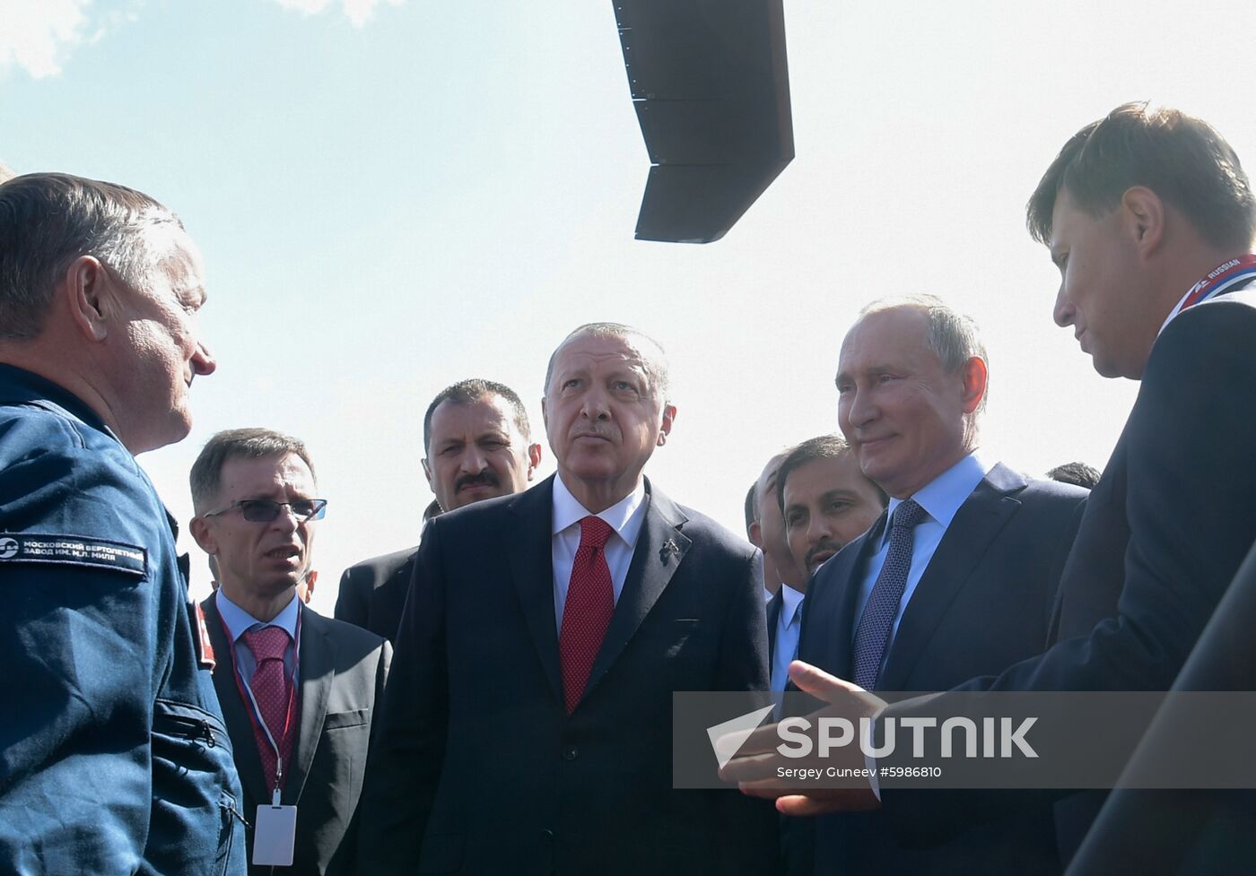 Russian President Vladimir Putin and his Turkish counterpart Recep Tayyip Erdogan inspect a Mil Mi-38 transport helicopter at the MAKS-2019 international aviation and space show in Zhukovsky, outside Moscow, Russia. Location: Russia, Zhukovsky. Author: Sergey Guneev/Sputnik. Russia MAKS Air Show Putin Erdogan