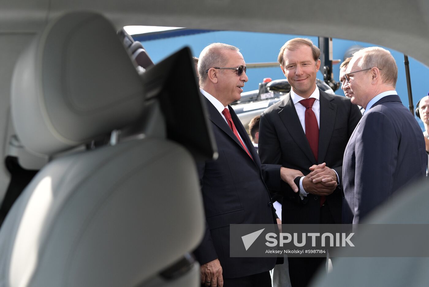 Russian President Vladimir Putin and his Turkish President Recep Tayyip Erdogan speaks with his Russian conterpart Vladimir Putin and Industry and Trade Minister Denis Manturov during a visit to the MAKS-2019 International Aviation and Space Show in Zhukovsky, outside Moscow, Russia. Location: Russia, Moscow region, Zhukovsky. Author: Aleksey Nikolskyi/Sputnik. Russia MAKS Air Show Putin Erdogan