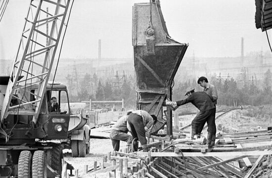 Students at brick factory construction site