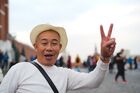 A tourist poses for a photo at the Red Square, in downtown Moscow, Russia. Location: Russia, Moscow. Author: Sergey Pyatakov/Sputnik. Russia Tourists