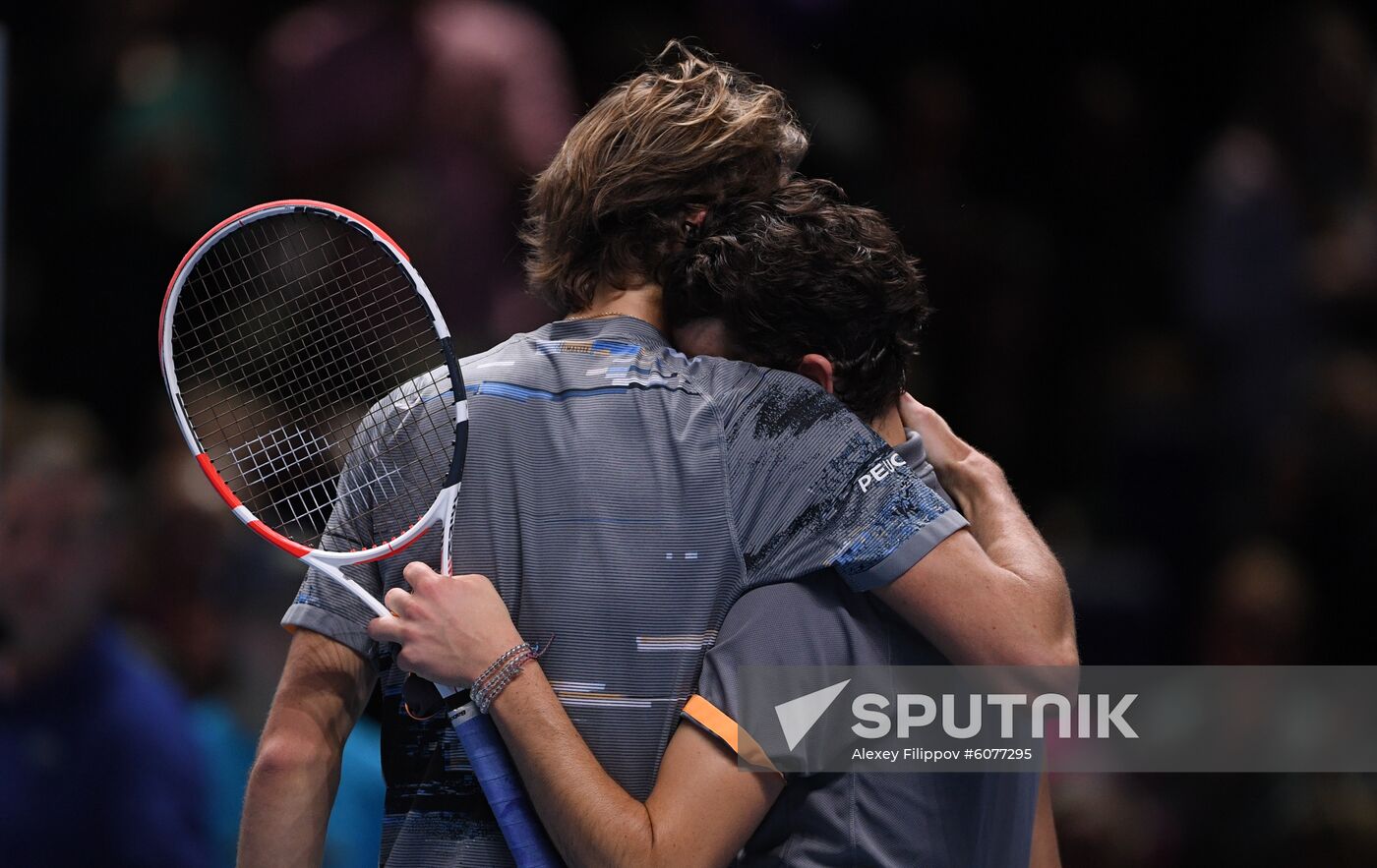Germany's Alexander Zverev, left, and Austria's Dominic Thiem hug each other after the semi final men's singles tennis match at the ATP World Tour Finals tournament in London, Britain. Location: United Kingdom, London. Author: Alexey Filippov/Sputnik. Britain Tennis ATP Tour Finals