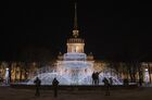 People pose for a photo near a fountain decorated with lights ahead of the New Year in the Alexander Garden, in Saint Petersburg, Russia. Russians prepare to celebrate New Year's Eve on 31 December and Christmas which is observed on 07 January, according to the Russian Orthodox Julian calendar 13 days after Christmas on 25 December on the Gregorian calendar. Location: Russia, Saint Petersburg. Author: Alexei Danichev/Sputnik. Russia New Year Preparations