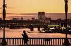 A woman walks at Krymsky Bridge with the Russian Academy of Sciences on the background, in Moscow, Russia. Location: Russia, Moscow. Author: Vladimir Astapkovich/Sputnik. Russia Moscow Daily Life