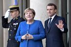 French President Emmanuel Macron and German Chancellor Angela Merkel, left, attend a welcoming ceremony before a meeting of the Normandy Four leaders at the Elysee Palace in Paris, France. The leaders of Ukraine, Russia, Germany and France are holding a series of meetings since 2014 to resolve the conflict between Kiev and the breakaway republics in Ukraine's east. Location: France, Paris. Author: Aleksey Nikolskyi. France Normandy Four Summit