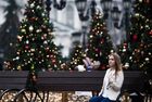 A woman poses for a photo in the street decorated for the upcoming New Year and Christmas season on an extremely warm winter day, in Moscow, Russia. Location: Russia, Moscow. Author: Vladimir Astapkovich/Sputnik. Russia Moscow Weather
