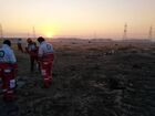 In this handout photo released by Iranian Red Crescent Society (IRCS), people work at the site of the Ukraine International Airlines' Boeing 737-800 passenger plane crash in the vicinity of the town of Parand, outside Tehran, Iran. The plane which was bound for Ukraine's capital of Kiev with almost 170 people on board, crashed earlier in the day shortly after take-off from Imam Khomeini International Airport. All passengers and crew lost their lives in the crash incident. Editorial use only, no archive, no commercial use. Location: Iran, Tehran. Iran Ukraine Plane Crash