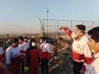 In this handout photo released by Iranian Red Crescent Society (IRCS), people work at the site of the Ukraine International Airlines' Boeing 737-800 passenger plane crash in the vicinity of the town of Parand, outside Tehran, Iran. The plane which was bound for Ukraine's capital of Kiev with almost 170 people on board, crashed earlier in the day shortly after take-off from Imam Khomeini International Airport. All passengers and crew lost their lives in the crash incident. Editorial use only, no archive, no commercial use. Location: Iran, Tehran. Iran Ukraine Plane Crash