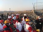 In this handout photo released by Iranian Red Crescent Society (IRCS), people work at the site of the Ukraine International Airlines' Boeing 737-800 passenger plane crash in the vicinity of the town of Parand, outside Tehran, Iran. The plane which was bound for Ukraine's capital of Kiev with almost 170 people on board, crashed earlier in the day shortly after take-off from Imam Khomeini International Airport. All passengers and crew lost their lives in the crash incident. Editorial use only, no archive, no commercial use. Location: Iran, Tehran. Iran Ukraine Plane Crash