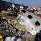In this handout photo released by Iranian Red Crescent Society (IRCS), people work at the site of the Ukraine International Airlines' Boeing 737-800 passenger plane crash in the vicinity of the town of Parand, outside Tehran, Iran. The plane which was bound for Ukraine's capital of Kiev with almost 170 people on board, crashed earlier in the day shortly after take-off from Imam Khomeini International Airport. All passengers and crew lost their lives in the crash incident. Editorial use only, no archive, no commercial use. Location: Iran, Tehran. Iran Ukraine Plane Crash