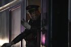 A conductor gestures in the doorway of a passenger train en route from Beijing to Moscow at Novosibirsk-Glavny railway station in Novosibirsk, Russia. Russia has suspended railway service with China starting January 31 to prevent the spread of the deadly coronavirus infection in the country, trains will be allowed to move only on Moscow-Beijing route in both directions. Location: Russia, Novosibirsk. Author: Alexandr Kryazhev/Sputnik. Russia New Coronavirus