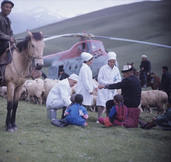 Doctors examine patients in Kyrgyzstan