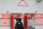 A woman wearing a protective face mask due to coronavirus (COVID-19) concerns walks in the street, in Warsaw, Poland. On Friday March 13 infections outside China have been reported by 125 countries. Location: Poland, Warsaw. Author: Alexey Vitvitsky/Sputnik. Poland Coronavirus