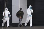 Medics wearing protective suits lead a man in a protective face mask to a hospital complex in Kommunarka settlement, in Moscow, Russia. Russia has so far recorded 45 cases of new coronavirus. Location: Russia, Moscow. Author: Vitaliy Belousov/Sputnik. Russia Coronavirus