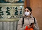 A woman wearing a protective face mask amid the coronavirus outbreak waits in Moscow's subway, in Moscow, Russia. Location: Russia, Moscow. Author: Maksim Blinov/Sputnik. Russia New Coronavirus