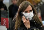 A woman wearing a protective face mask amid the coronavirus outbreak passes through turnstiles of Moscow's subway, in Moscow, Russia. Location: Russia, Moscow. Author: Maksim Blinov/Sputnik. Russia New Coronavirus