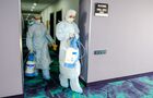 Workers wearing a protective mask carry out disinfection at the Meridian Congress hotel in Murmansk, Russia. A foreign participant in a chess tournament held at the Meridian hotel in Murmansk was diagnosed with a previously positive case of coronavirus. Location: Russia, Murmansk. Author: Pavel Lvov/Sputnik. Russia Coronavirus