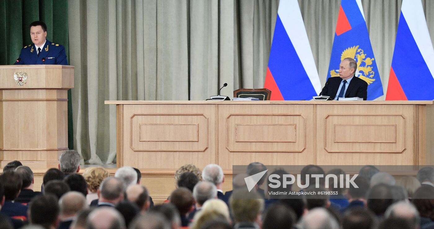 Russian President Vladimir Putin listens as Prosecutor General Igor Krasnov makes his speech during a meeting of the Prosecutor General's Office Board in Moscow, Russia. Location: Russia, Moscow. Author: Vladimir Astapkovich/Sputnik. Russia Prosecutor General's Office Board