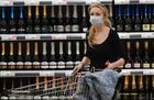 A woman wears a protective mask following an outbreak of the coronavirus disease (COVID-19), while shopping in a Globus hypermarket in Moscow, Russia. Location: Russia, Moscow. Author: Maksim Blinov/Sputnik. Russia Coronavirus